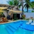 [Image: ¡Escapada Perfecta a la Playa! ¡Paga Q349 en Lugar de Q850 por 1 Noche para 2 Personas en Cabaña Tipo Hawaii con Baño Privado o Habitaciones Dobles con Baño Privado + Snacks de Desayuno + Uso de Instalaciones: Piscina, Hamacas y Más!m]