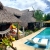 [Image: ¡Escapada Perfecta a la Playa! ¡Paga Q349 en Lugar de Q850 por 1 Noche para 2 Personas en Cabaña Tipo Hawaii con Baño Privado o Habitaciones Dobles con Baño Privado + Snacks de Desayuno + Uso de Instalaciones: Piscina, Hamacas y Más!m]