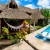 [Image: ¡Escapada Perfecta a la Playa! ¡Paga Q349 en Lugar de Q850 por 1 Noche para 2 Personas en Cabaña Tipo Hawaii con Baño Privado o Habitaciones Dobles con Baño Privado + Snacks de Desayuno + Uso de Instalaciones: Piscina, Hamacas y Más!m]
