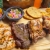 [Imagen:¡Paga $13.50 en Lugar de $27 por Parrillada Para 2 que Incluye: 6 Onz de Lomo de Res + 6 Onz de Filete de Pollo + 4 Onz de Costilla de Cerdo + 1 Chorizo + Acompañamientos: Frijoles, Chimichurri, Papas Fritas + 2 Boquitas + 2 Sodas!]