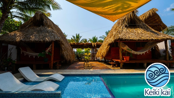 [Image: ¡Escapada Perfecta a la Playa! ¡Paga Q365 en Lugar de Q850 por 1 Noche para 2 Personas en Cabaña Tipo Hawaii con Baño Privado o Habitaciones Dobles con Baño Privado + Snacks de Desayuno + Uso de Instalaciones: Piscina, Hamacas y Más!m]